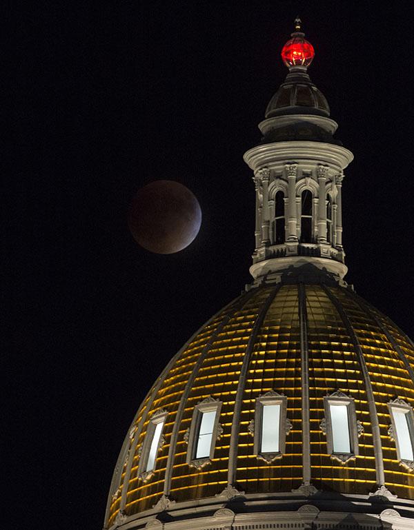 A+perigee+full+moon%2C+or+supermoon%2C+is+seen+during+a+total+lunar+eclipse+behind+the+Colorado+State+Capitol+Building+on+Sunday%2C+Sept.+27%2C+2015%2C+in+Denver.++The+combination+of+a+supermoon+and+total+lunar+eclipse+last+occurred+in+1982+and+will+not+happen+again+until+2033.++Photo+Credit%3A+%28NASA%2FBill+Ingalls%29