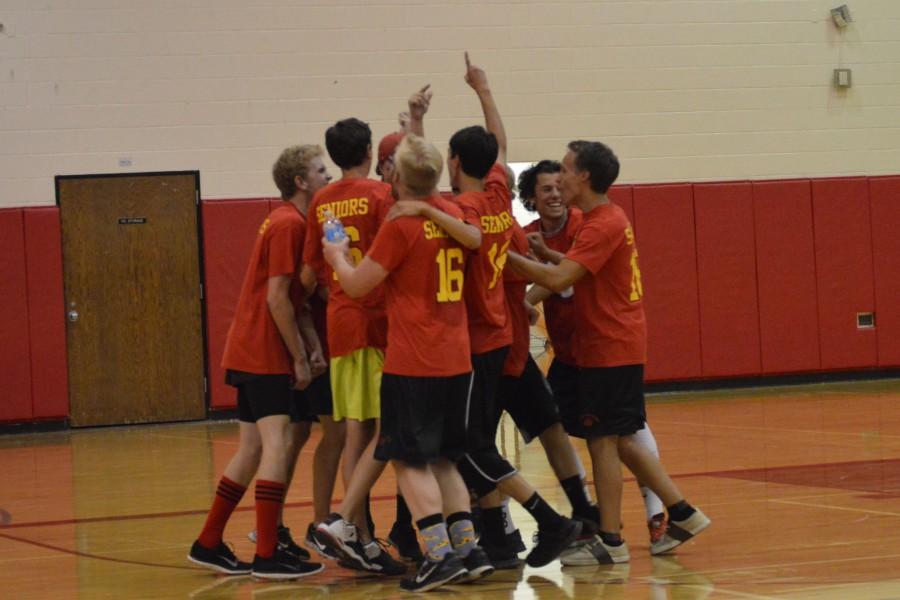 The Senior Team celebrates its victory after the final set of the Peach Fuzz game.