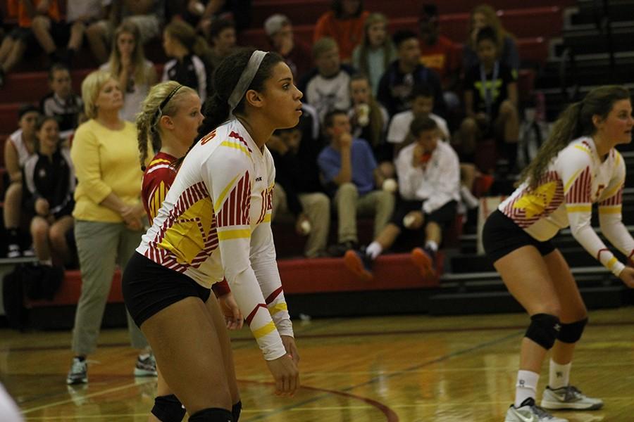 Seniors Madison Brown, Allie Garcia, and Kaira Smith ready on serve receive against Liberty on Sept. 29. 