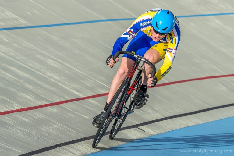 Isaac Ross, essay winner, bikes on the track at the Velodrome.