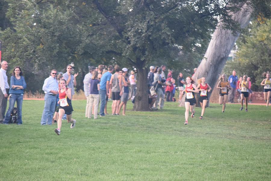 Taylor Dutton charges down the homestretch of the Cougar Classic followed closely behind by Maddy Morland and Faith Roth. The trio helped the Cougars to a second place finish.