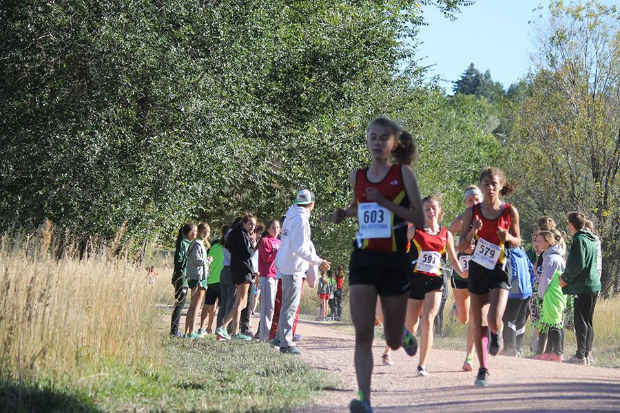 Freshman Grace Abernethy and three of Coronado's nine varsity runners are within feet of each other at the Doherty Spartan Invitational at Bear Creek Park on 10/7.
