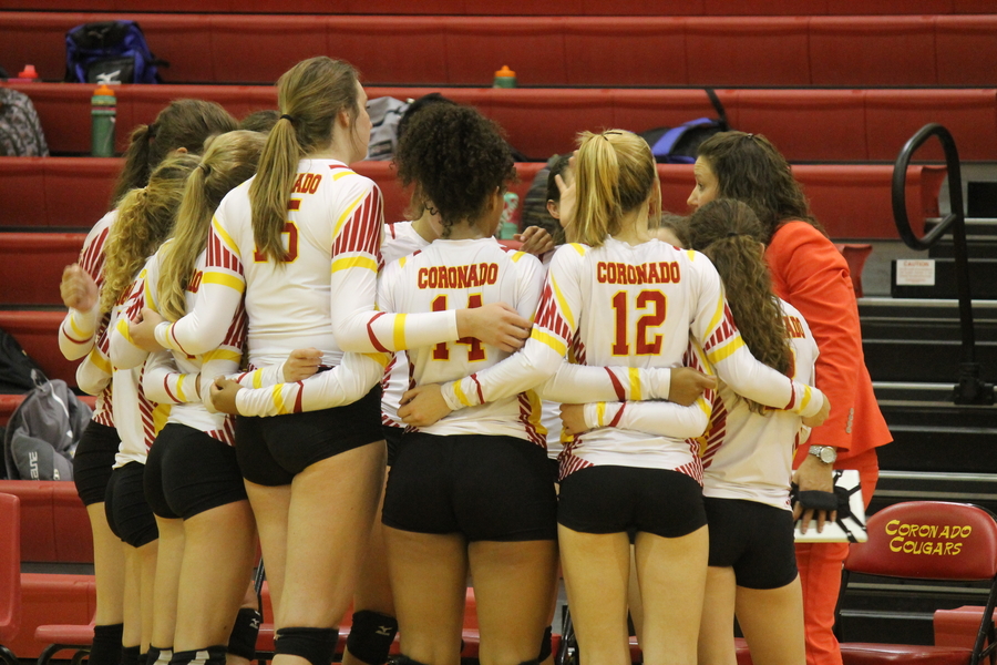 The Varsity Volleyball team huddling up and laying out their killer game plan!
