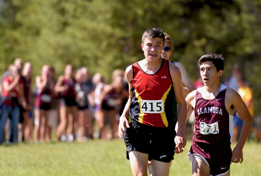  Ben Swanson approaches from behind in the last 50 meters of the race to beat DeLaCerda of Alamosa.