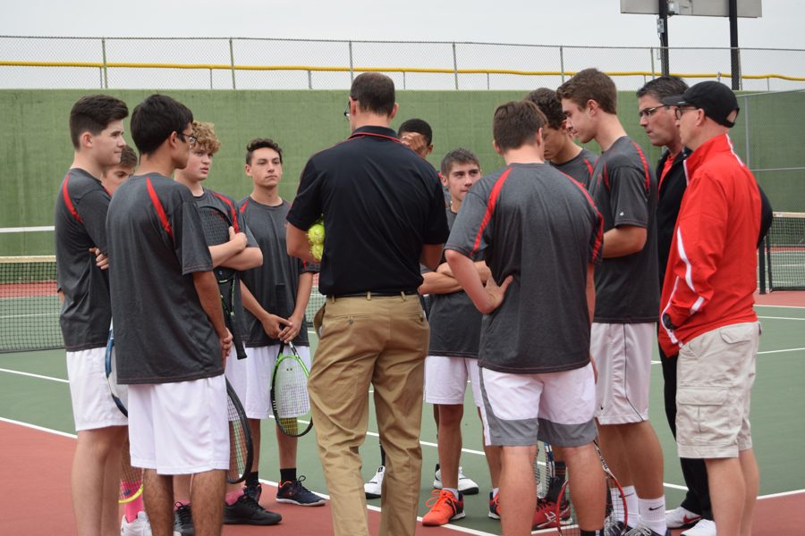 Senior Ashton Rogers and the Coronado men's tennis team in the huddle during the 2017 season.