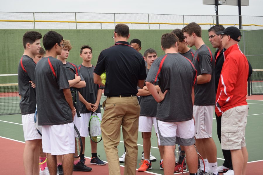 Varsity mens tennis huddles during the 2017-2018 season; mens tennis entire roster was recognized by the CSML.  