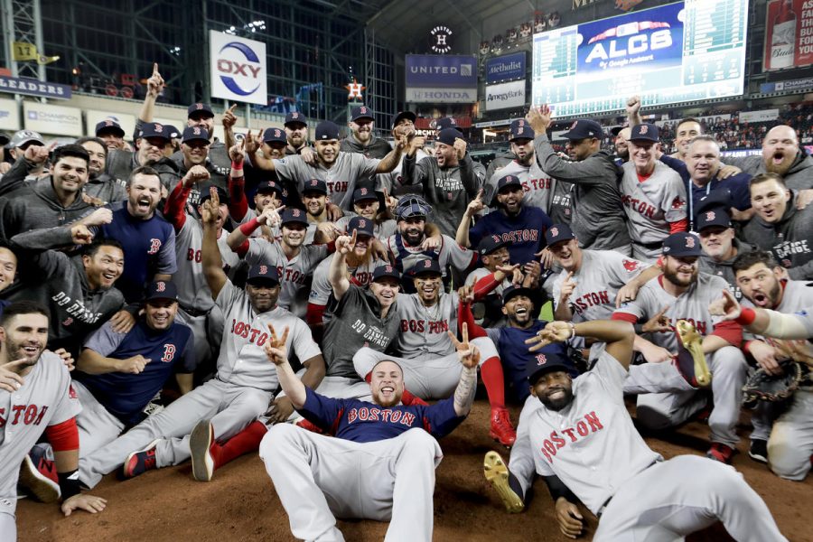 The Boston Red Sox pose for a picture after winning the baseball American League Championship Series against the Houston Astros on Thursday, Oct. 18, 2018, in Houston. Red Sox won 4-1. 