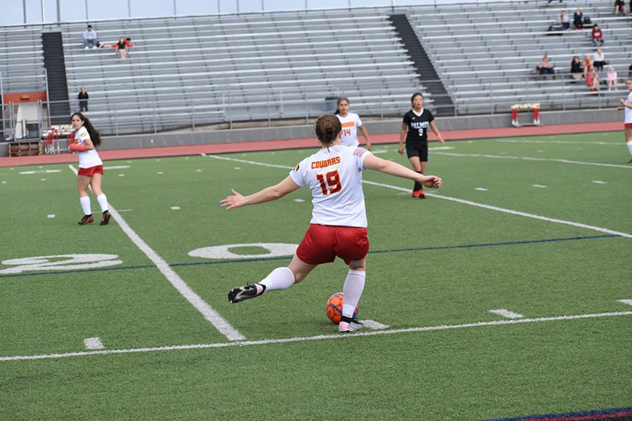 Lauren Strizich, 11, making a pass towards the goal.