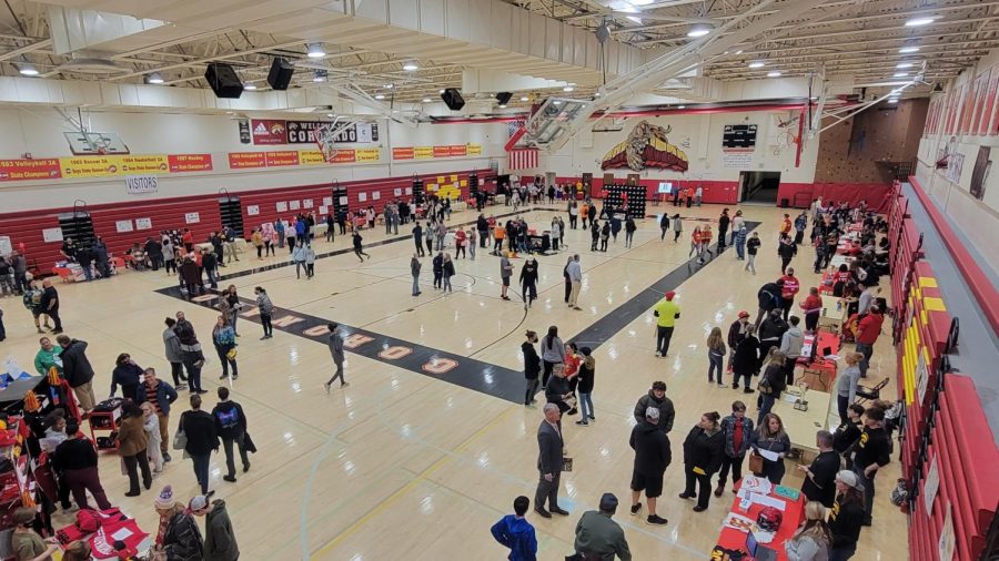 Sports and clubs hosted booths in the main gym for the 8th grade open house