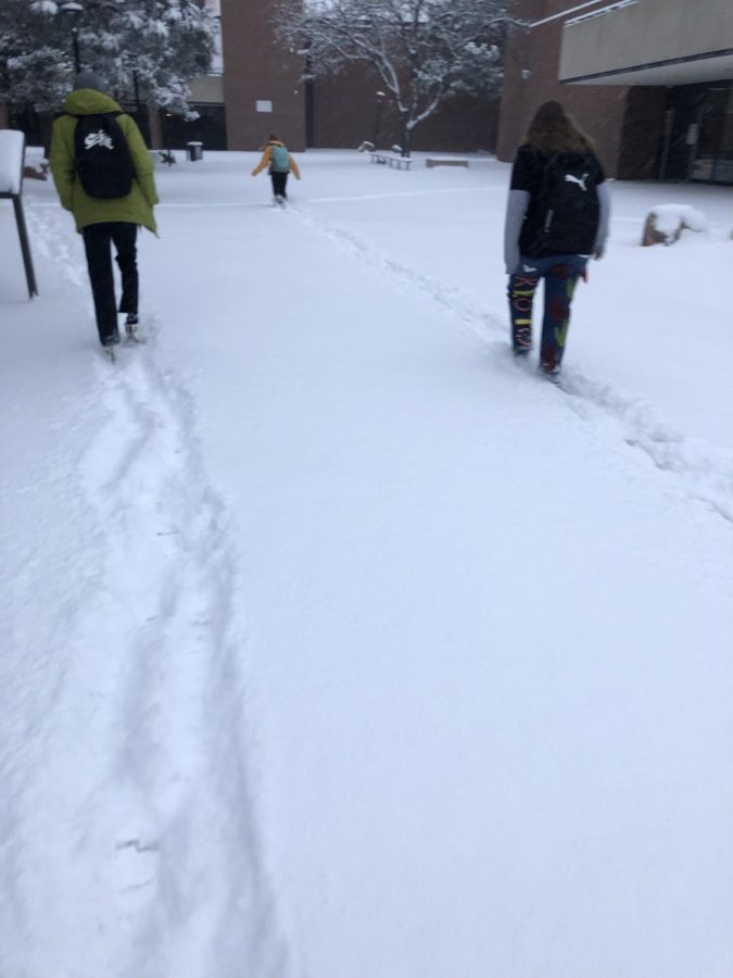 Students trudging to school as Colorado experienced its first major snowfall