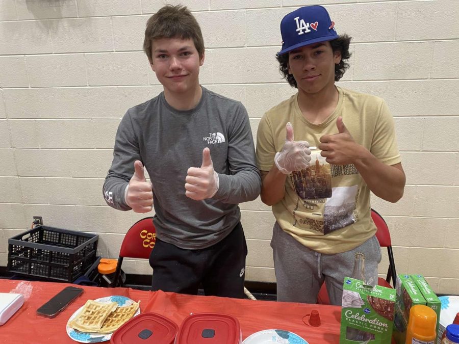 Oliver Bushman and Max Garza working hard at their waffle stand.