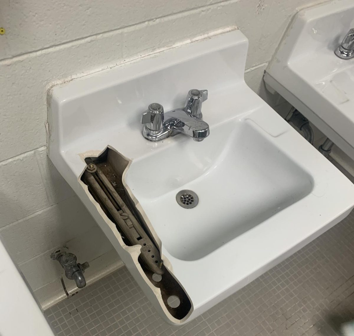 Students broke the sink in the girls bathroom during the school day.