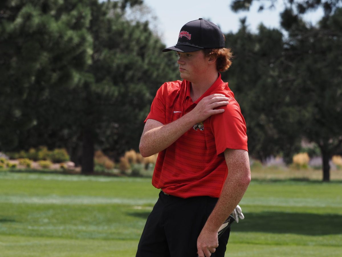 Carson Greene considers a putt at Kissing Camels Country Club.