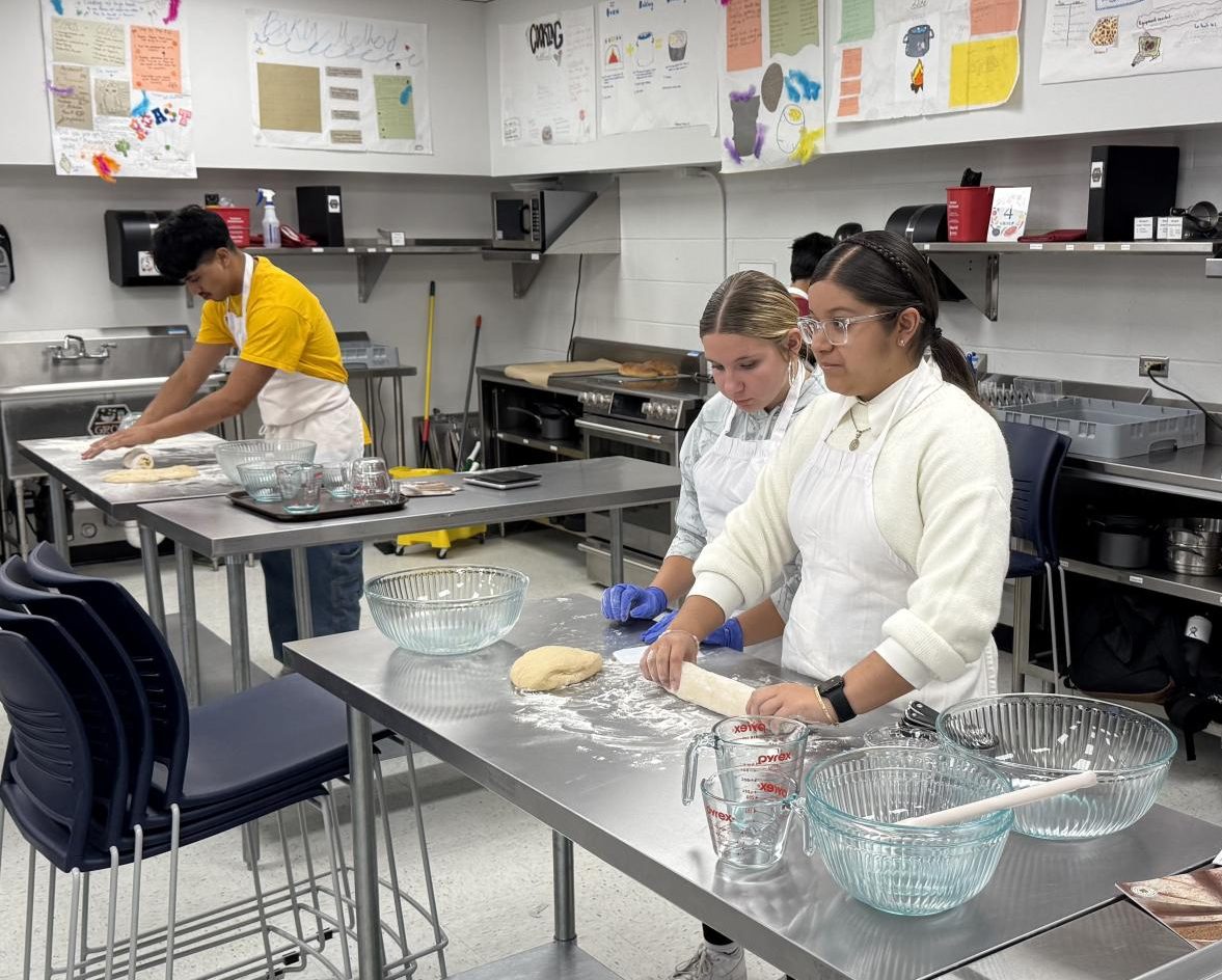 Alondra Laris and her classmates prepare the dough. 