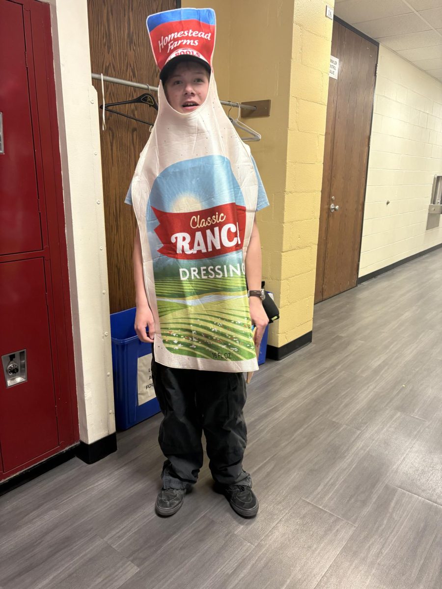 Student dressed up as a bottle of ranch for Holiday day.
