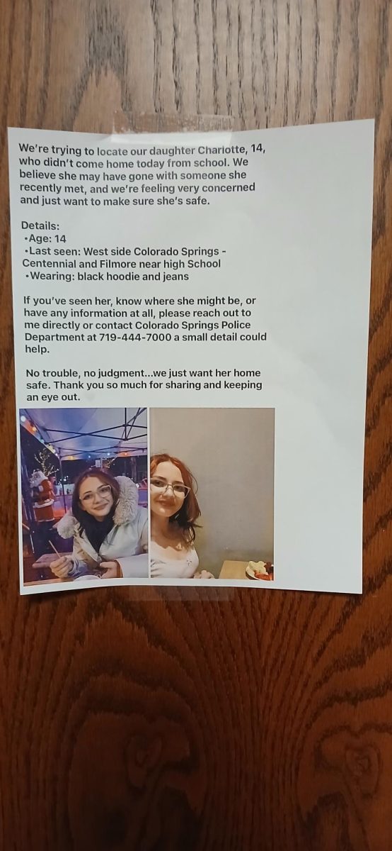 Charlotte's missing poster hanging on Ms. Mooney's door.