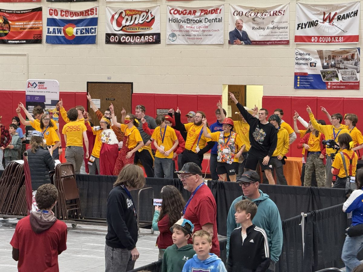 Cougars Gone Wired shows their spirit while doing the team dance at the Pikes Peak Regional